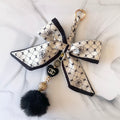 Cici Gold and Black Bow Bag Charm
